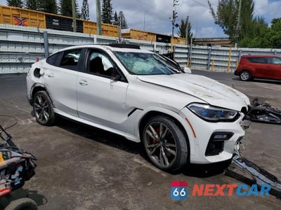 Czwarte zdjęcie samochodu z boku: 2021 BMW X6 M50I VIN:5UXCY8C02M9F23278 - miniatura