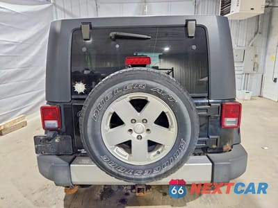 Zdjęcie 6 z 12 samochodu: 2010 JEEP WRANGLER UNLIMITED SAHARA VIN:1J4BA5H17AL116967 - miniatura