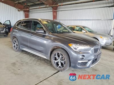 Czwarte zdjęcie samochodu z boku: 2018 BMW X1 XDRIVE28I VIN:WBXHT3C30J5K31053 - miniatura