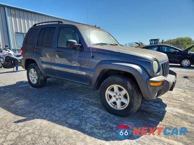 Czwarte zdjęcie samochodu z boku: 2002 JEEP LIBERTY SPORT VIN:1J4GL48K02W297445 - miniatura