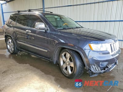 Czwarte zdjęcie samochodu z boku: 2013 JEEP GRAND CHEROKEE OVERLAND VIN:1C4RJFCT9DC525494 - miniatura