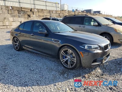 Czwarte zdjęcie samochodu z boku: 2014 BMW M5 VIN:WBSFV9C54ED097655 - miniatura