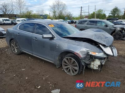 Czwarte zdjęcie samochodu z boku: 2012 LINCOLN MKS VIN:1LNHL9FT0CG807237 - miniatura