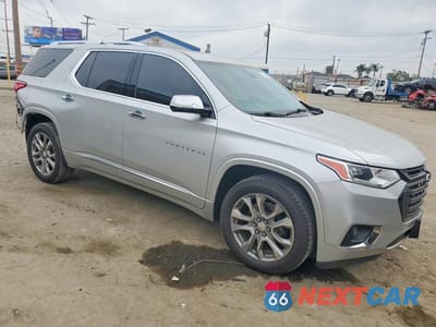 Czwarte zdjęcie samochodu z boku: 2019 CHEVROLET TRAVERSE PREMIER VIN:1GNERKKW1KJ190887 - miniatura