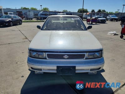 Piąte zdjęcie samochodu w środku: 1994 NISSAN MAXIMA SE VIN:JN1EJ01F9RT506110 - miniatura
