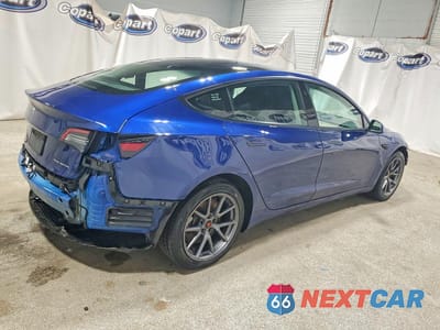 Trzecie zdjęcie samochodu z tyłu: 2022 TESLA MODEL 3 VIN:5YJ3E1EB0NF290831 - miniatura