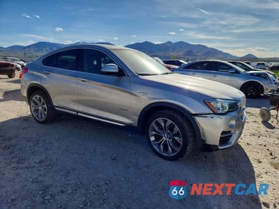 Czwarte zdjęcie samochodu z boku: 2016 BMW X4 XDRIVE28I VIN:5UXXW3C54G0R18669 - miniatura