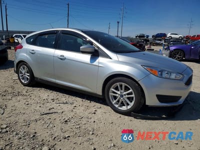 Czwarte zdjęcie samochodu z boku: 2018 FORD FOCUS SE VIN:1FADP3K22JL234322 - miniatura