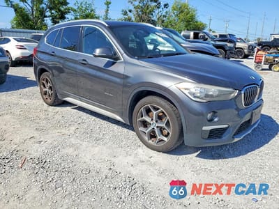 Czwarte zdjęcie samochodu z boku: 2018 BMW X1 XDRIVE28I VIN:WBXHT3C3XJ5K23316 - miniatura