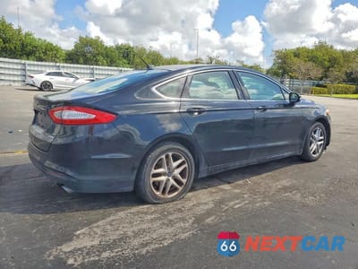 Trzecie zdjęcie samochodu z tyłu: 2016 FORD FUSION SE VIN:3FA6P0HD2GR394517 - miniatura