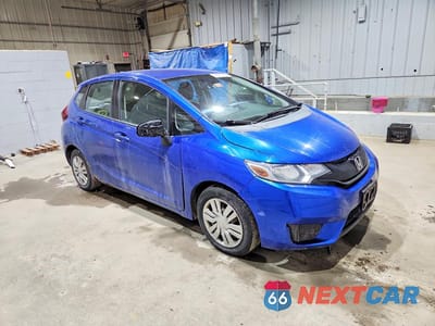 Czwarte zdjęcie samochodu z boku: 2015 HONDA FIT LX VIN:3HGGK5H50FM735395 - miniatura
