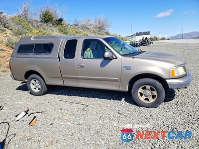 Czwarte zdjęcie samochodu z boku: 2002 FORD F150 VIN:1FTRX17L12NB94407 - miniatura