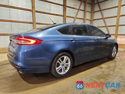 Trzecie zdjęcie samochodu z tyłu: 2018 FORD FUSION SE VIN:3FA6P0HD4JR251950 - miniatura