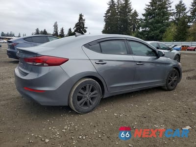 Trzecie zdjęcie samochodu z tyłu: 2018 HYUNDAI ELANTRA VALUE EDITION VIN:5NPD84LF2JH394445 - miniatura