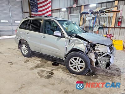 Czwarte zdjęcie samochodu z boku: 2002 TOYOTA RAV4 BASE VIN:JTEGH20V720077820 - miniatura