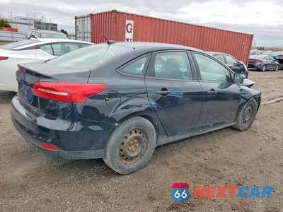 Trzecie zdjęcie samochodu z tyłu: 2017 FORD FOCUS SE VIN:1FADP3F28HL273372 - miniatura