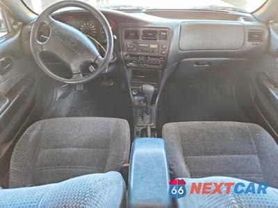 Zdjęcie 8 z 12 samochodu: 1995 TOYOTA COROLLA DX VIN:1NXAE09B0SZ312417 - miniatura