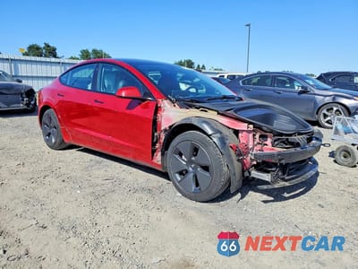 Czwarte zdjęcie samochodu z boku: 2023 TESLA MODEL 3 VIN:5YJ3E1EA1PF598147 - miniatura