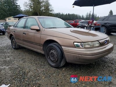 Czwarte zdjęcie samochodu z boku: 1992 FORD TAURUS GL VIN:1FACP52U8NG231691 - miniatura