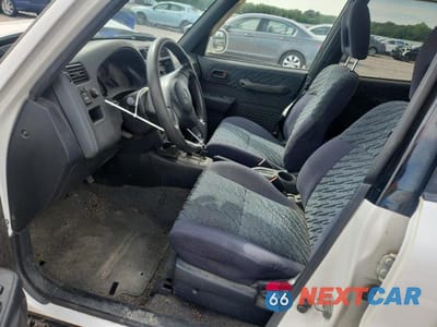 Zdjęcie 7 z 13 samochodu: 1999 TOYOTA RAV4 BASE VIN:JT3HP10V7X7117595 - miniatura