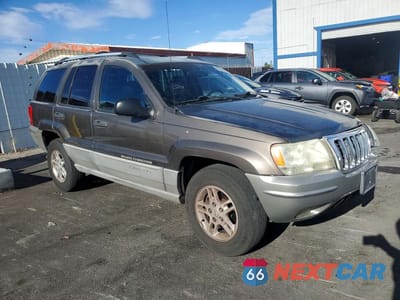 Czwarte zdjęcie samochodu z boku: 2000 JEEP GRAND CHEROKEE LAREDO VIN:1J4G248S2YC227054 - miniatura