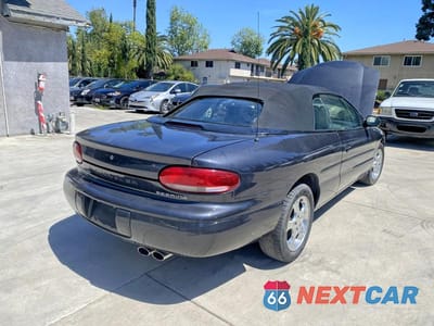 Czwarte zdjęcie samochodu z boku: 1999 CHRYSLER SEBRING JXI VIN:3C3EL55H6XT591641 - miniatura