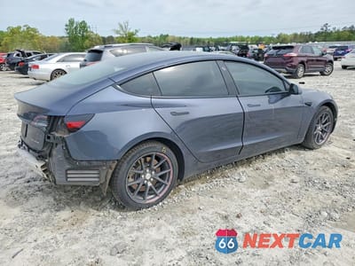 Trzecie zdjęcie samochodu z tyłu: 2021 TESLA MODEL 3 VIN:5YJ3E1EB0MF048958 - miniatura