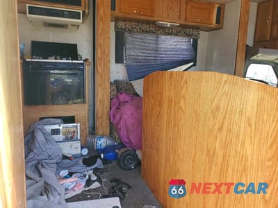 Zdjęcie 6 z 10 samochodu: 1999 FORD ECONOLINE E450 SUPER DUTY CUTAWAY VAN RV VIN:1FDXE40SXXHB08478 - miniatura