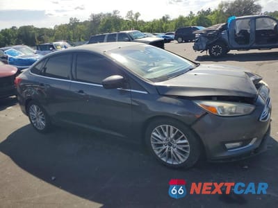 Czwarte zdjęcie samochodu z boku: 2017 FORD FOCUS TITANIUM VIN:1FADP3J29HL281696 - miniatura