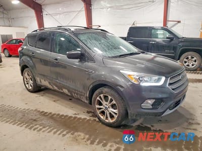 Czwarte zdjęcie samochodu z boku: 2018 FORD ESCAPE SEL VIN:1FMCU9HD2JUA07888 - miniatura