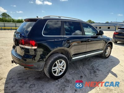 Trzecie zdjęcie samochodu z tyłu: 2010 VOLKSWAGEN TOUAREG TDI VIN:WVGFK7A90AD000497 - miniatura