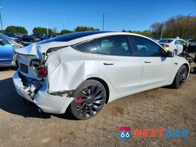 Trzecie zdjęcie samochodu z tyłu: 2023 TESLA MODEL 3 VIN:5YJ3E1EC7PF486034 - miniatura