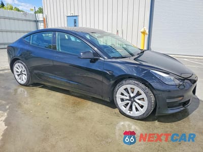 Czwarte zdjęcie samochodu z boku: 2022 TESLA MODEL 3 VIN:5YJ3E1EA9NF287160 - miniatura