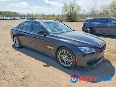 Czwarte zdjęcie samochodu z boku: 2014 BMW 750 VIN:WBAYB6C55ED224398 - miniatura
