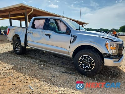 Czwarte zdjęcie samochodu z boku: 2023 FORD F150 SUPERCREW VIN:1FTFW1E58PFB77258 - miniatura