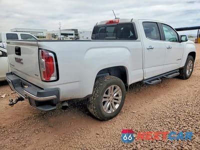 Trzecie zdjęcie samochodu z tyłu: 2016 GMC CANYON SLT VIN:1GTG5DE31G1127791 - miniatura