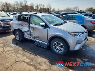 Czwarte zdjęcie samochodu z boku: 2018 TOYOTA RAV4 HYBRID XLE VIN:JTMRJREVXJD236419 - miniatura