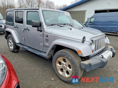 Czwarte zdjęcie samochodu z boku: 2013 JEEP WRANGLER UNLIMITED SAHARA VIN:1C4HJWEG8DL571605 - miniatura