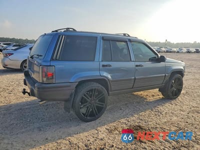 Trzecie zdjęcie samochodu z tyłu: 1995 JEEP GRAND CHEROKEE LAREDO VIN:1J4GZ58S3SC581352 - miniatura