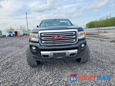 Piąte zdjęcie samochodu w środku: 2015 GMC CANYON SLT VIN:1GTG6CE3XF1259308 - miniatura