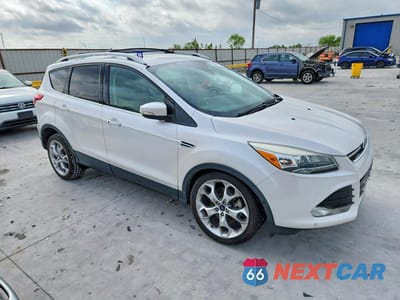 Czwarte zdjęcie samochodu z boku: 2016 FORD ESCAPE TITANIUM VIN:1FMCU0J93GUC78341 - miniatura