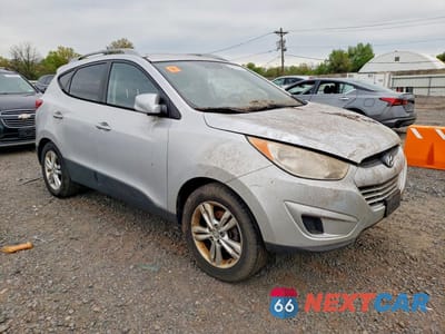 Czwarte zdjęcie samochodu z boku: 2010 HYUNDAI TUCSON GLS VIN:KM8JUCAC8AU046409 - miniatura