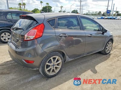 Trzecie zdjęcie samochodu z tyłu: 2015 FORD FIESTA SE VIN:3FADP4EJ0FM210485 - miniatura