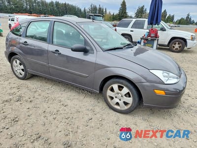 Czwarte zdjęcie samochodu z boku: 2002 FORD FOCUS ZX5 VIN:3FAHP37392R204031 - miniatura