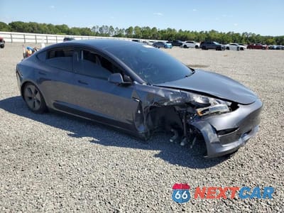 Czwarte zdjęcie samochodu z boku: 2023 TESLA MODEL 3 VIN:5YJ3E1EA1PF693002 - miniatura