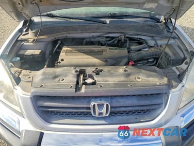 Zdjęcie 12 z 13 samochodu: 2004 HONDA PILOT EX VIN:2HKYF18474H527332 - miniatura