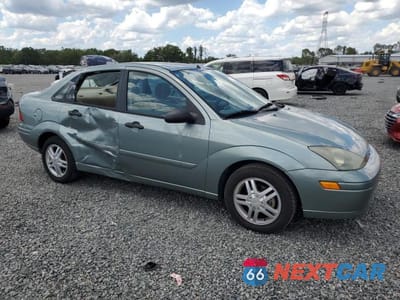 Czwarte zdjęcie samochodu z boku: 2003 FORD FOCUS SE VIN:1FAFP34P03W339556 - miniatura