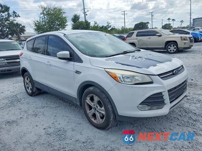 Czwarte zdjęcie samochodu z boku: 2016 FORD ESCAPE SE VIN:1FMCU0G77GUB66857 - miniatura