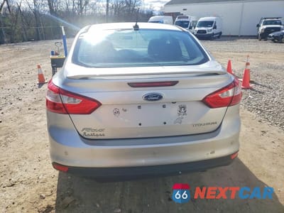 Zdjęcie 6 z 11 samochodu: 2014 FORD FOCUS TITANIUM VIN:1FADP3J23EL128579 - miniatura