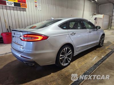 Trzecie zdjęcie samochodu z tyłu: 2020 FORD FUSION TITANIUM VIN:3FA6P0D91LR193283 - miniatura